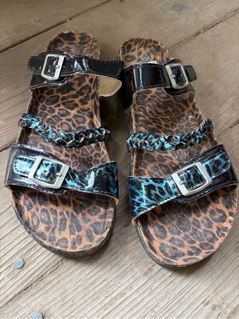 Women’s Muk Luks Leopard slip on sandals.